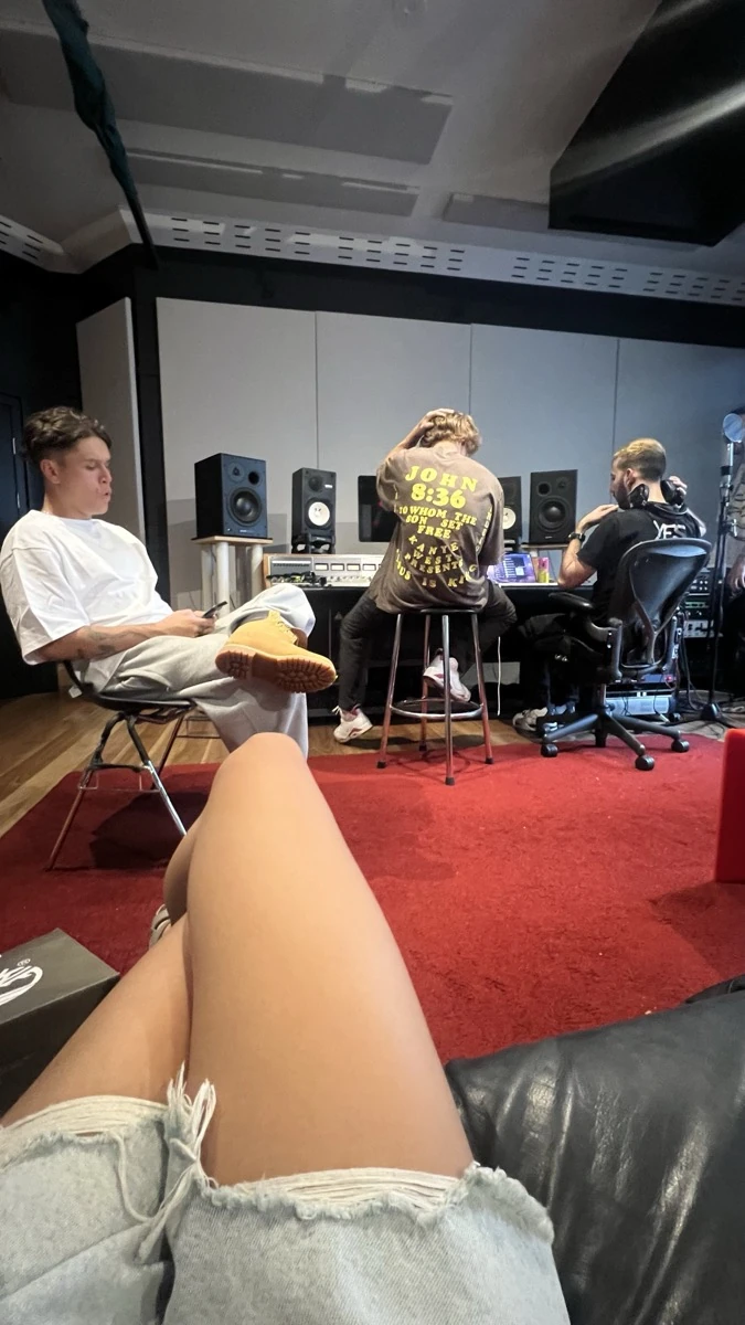 Studio session with producers working at a mixing desk